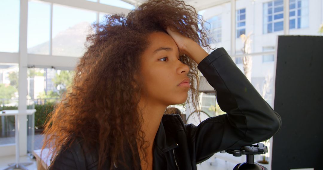 Teenage African American girl looks contemplative outdoors - Free Images, Stock Photos and Pictures on Pikwizard.com