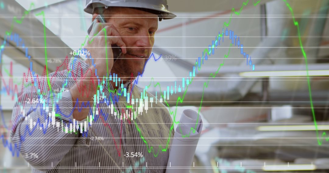 Engineer Using Smartphone with Financial Graphs Overlay - Free Images, Stock Photos and Pictures on Pikwizard.com