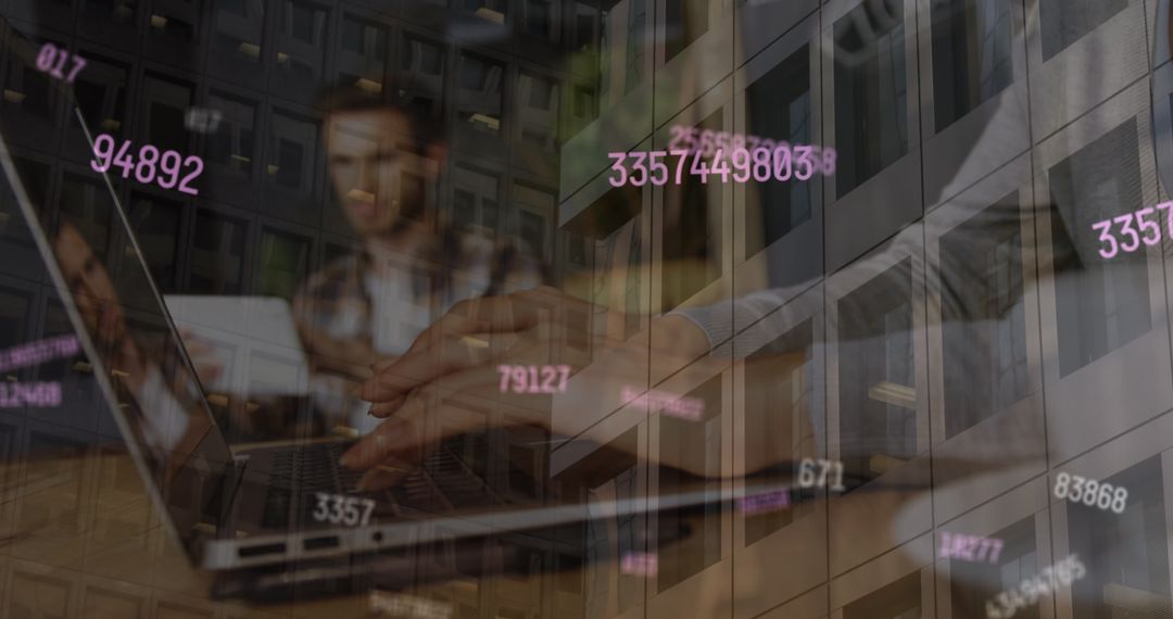 Person Typing on Laptop with Numerical Data Graphic Overlay