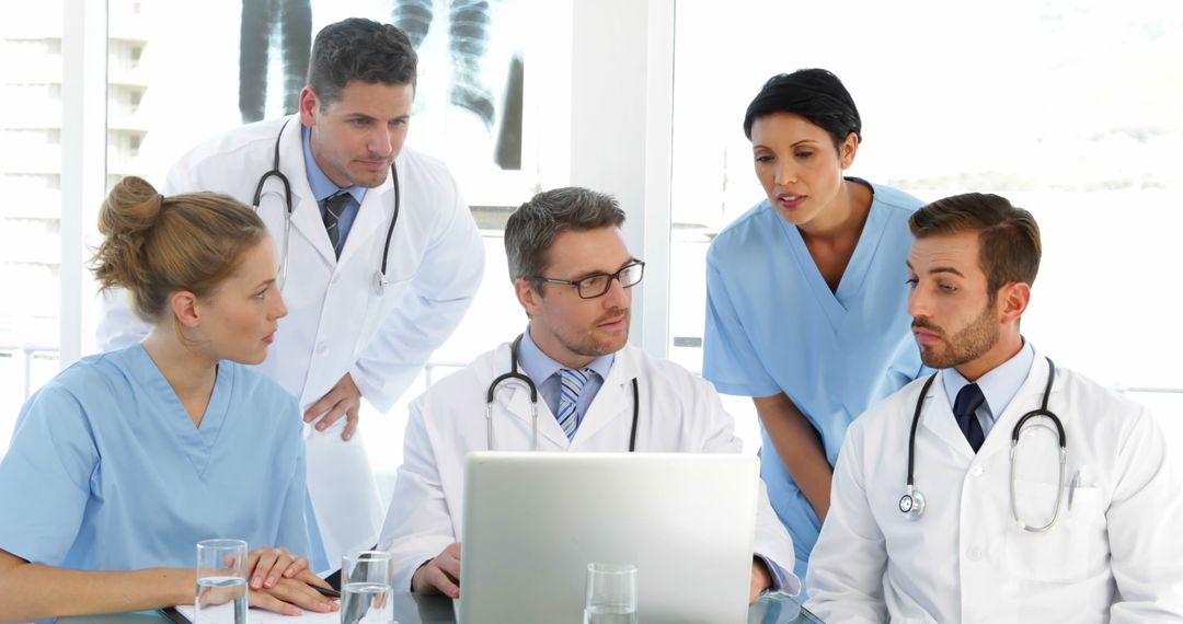 Medical Team Collaborating on Patient Diagnostic in Hospital - Free Images, Stock Photos and Pictures on Pikwizard.com