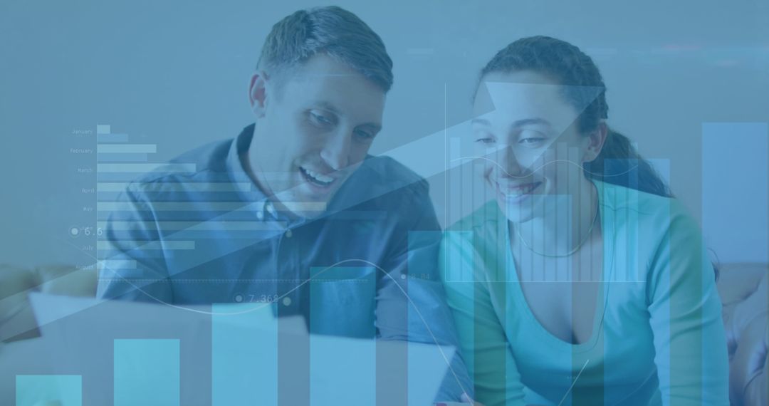 Couple Analyzing Financial Data with Digital Graph Overlays