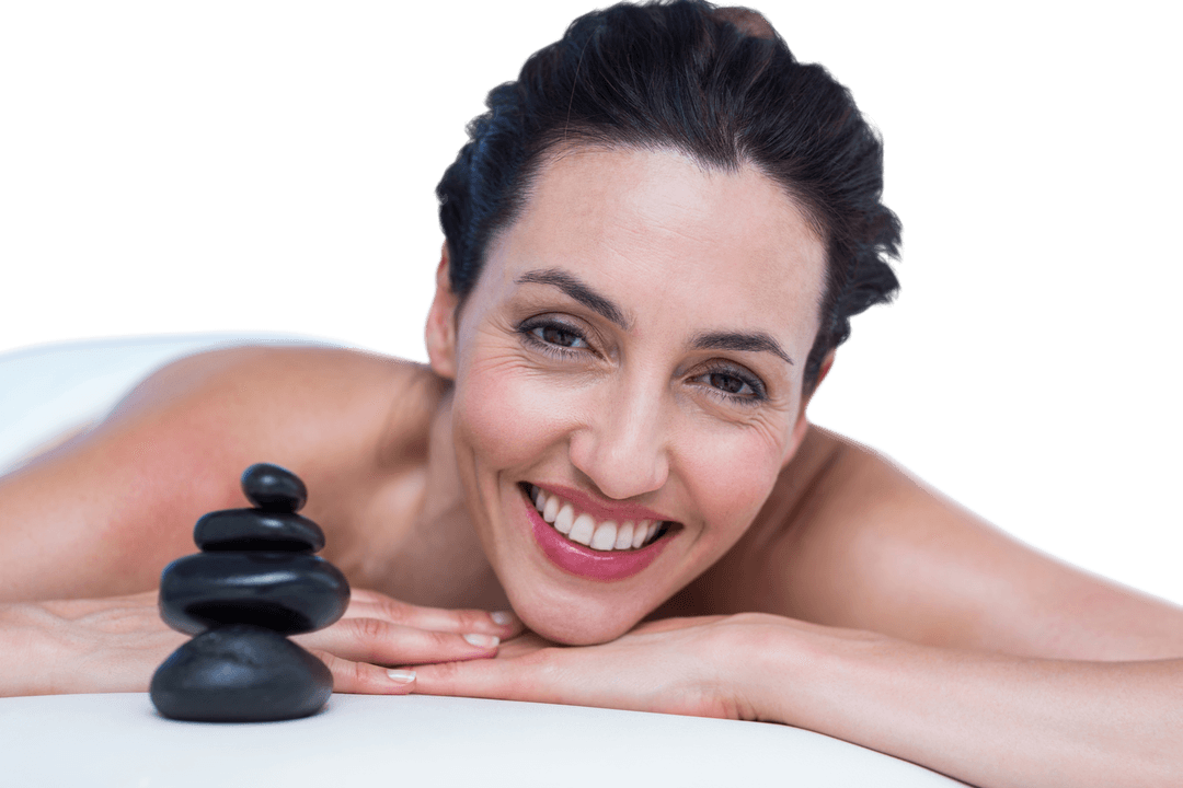Smiling Woman Relaxing with Massage Stones over Transparent Background
