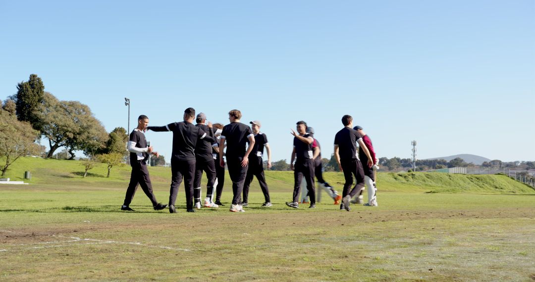 Diverse Athletes Collaborating on Outdoor Field in Activewear