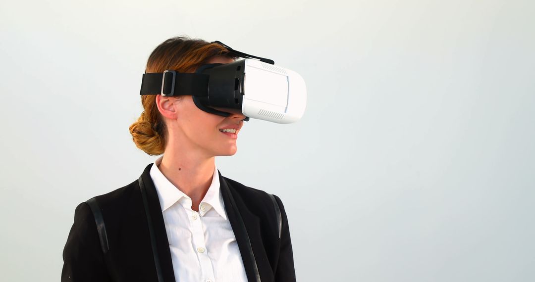 Businesswoman Practicing Virtual Reality with VR Headset in Office Attire - Free Images, Stock Photos and Pictures on Pikwizard.com