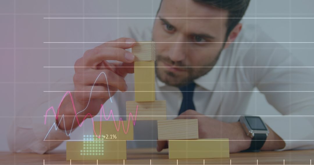 Focused Businessman Analyzing Financial Data with Graphs