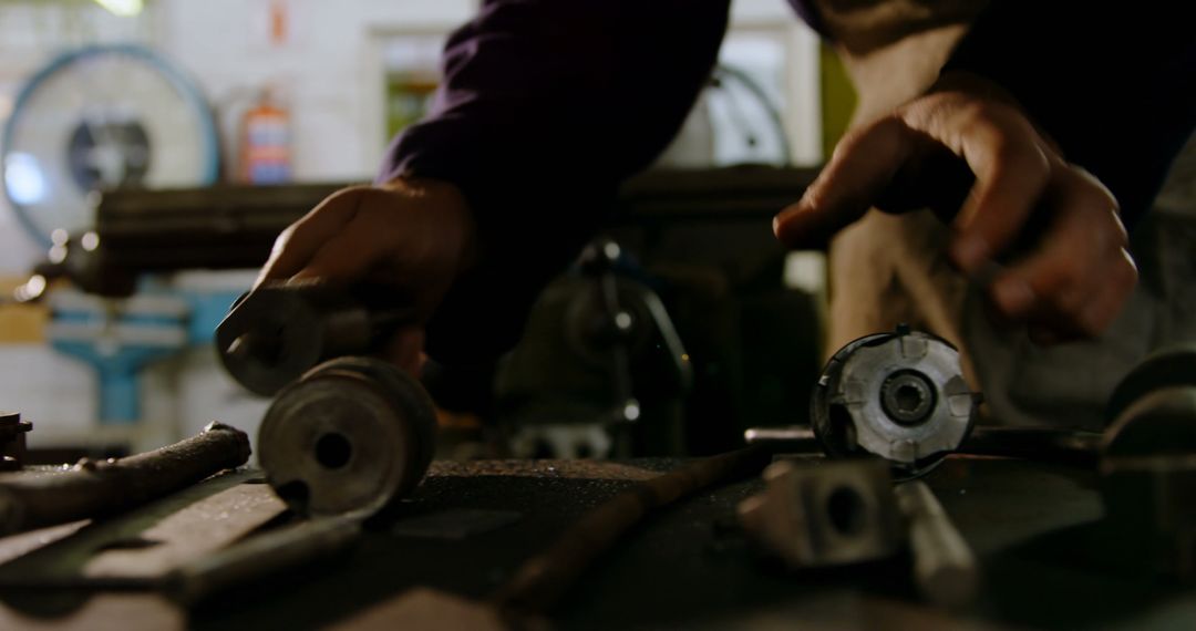 Industrial Worker Assembling Machine Parts in Workshop - Free Images, Stock Photos and Pictures on Pikwizard.com