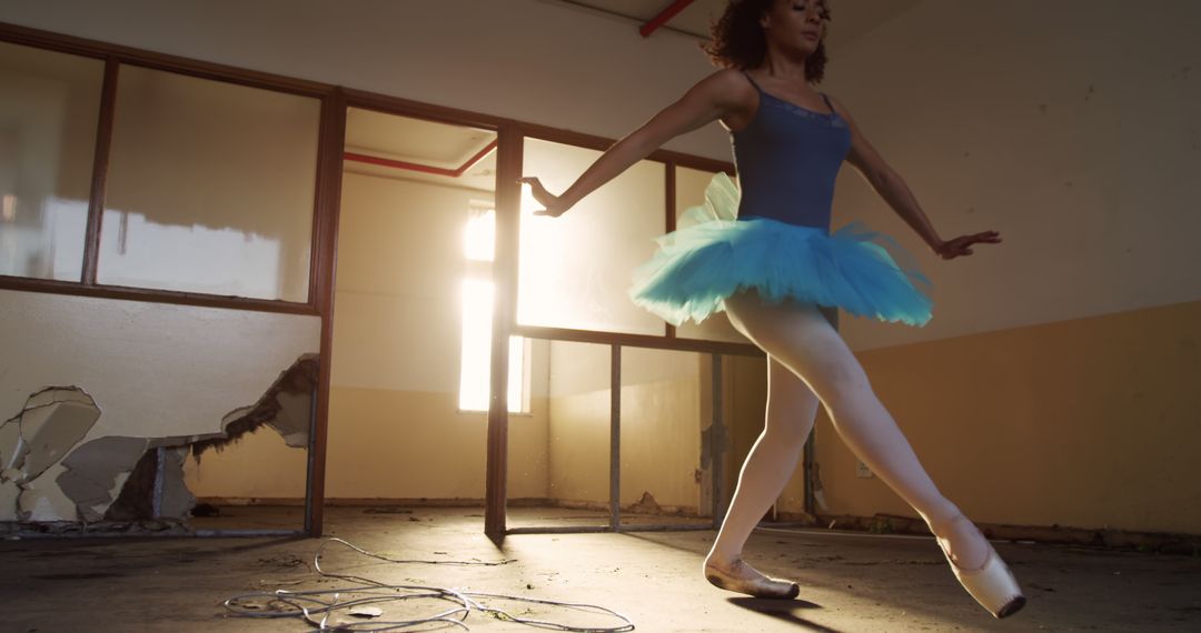 Ballet Dancer Practicing in Abandoned Warehouse Setting Sunlight