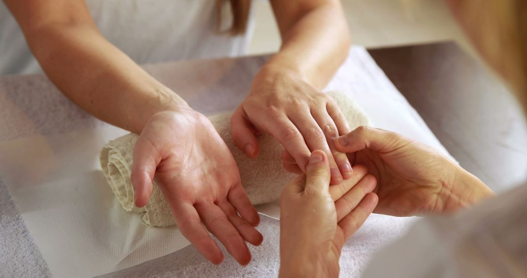 Therapist Giving Relaxing Hand Massage at Spa - Free Images, Stock Photos and Pictures on Pikwizard.com