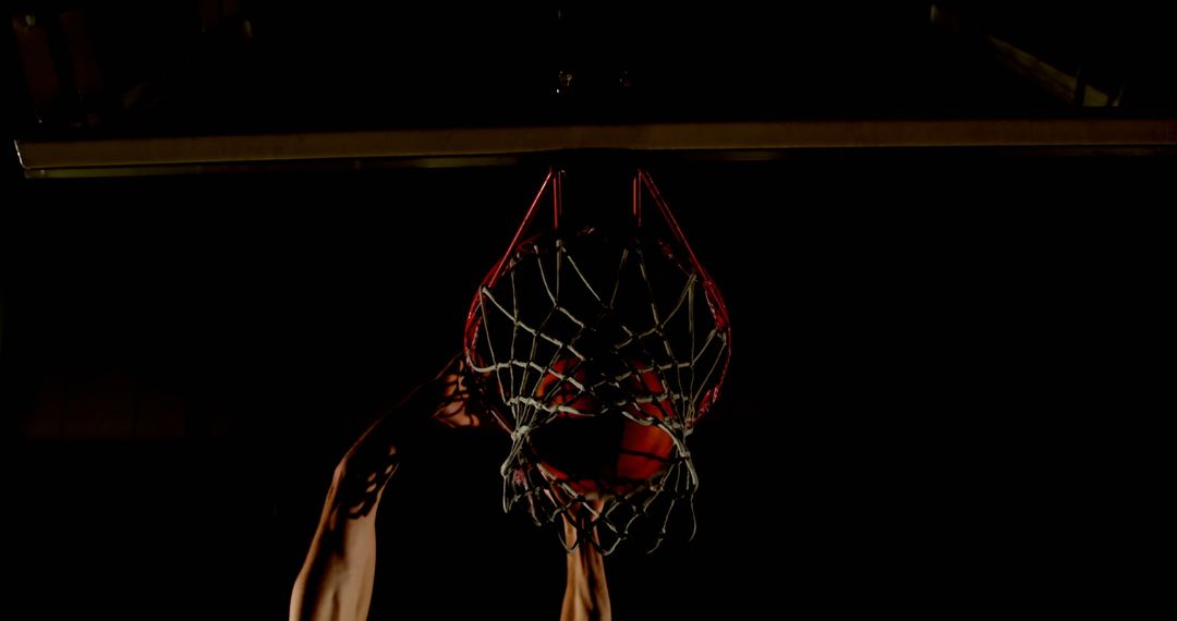 Dynamic Basketball Slam Dunk from Below Hoop View