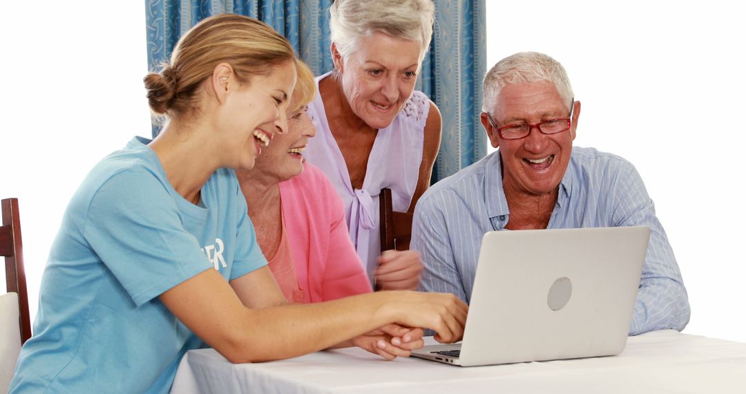 Young Woman Teaching Senior Friends Laptop Usage - Free Images, Stock Photos and Pictures on Pikwizard.com