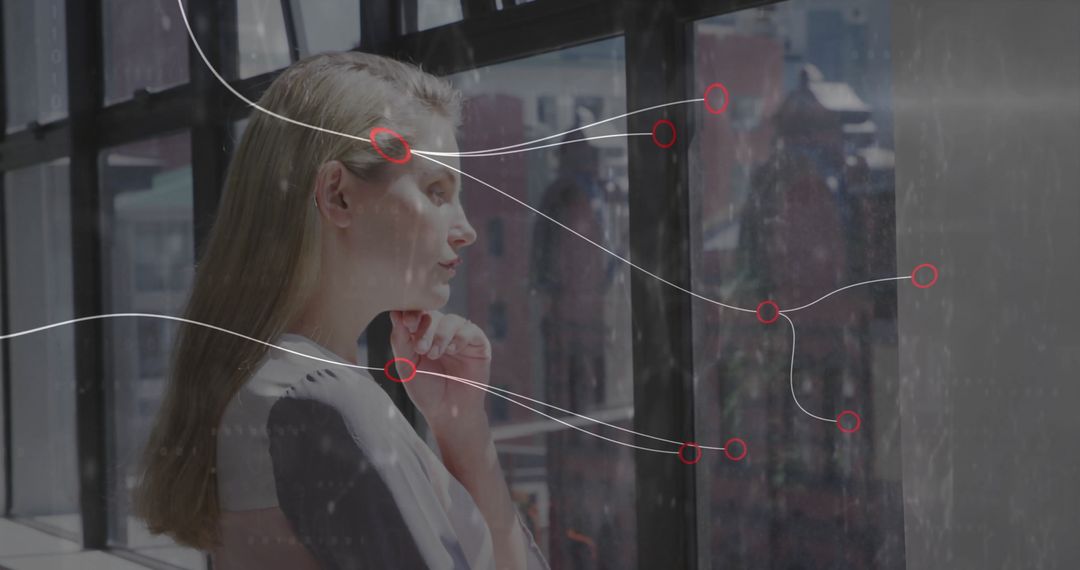 Woman Analyzing Data in Modern Office Environment