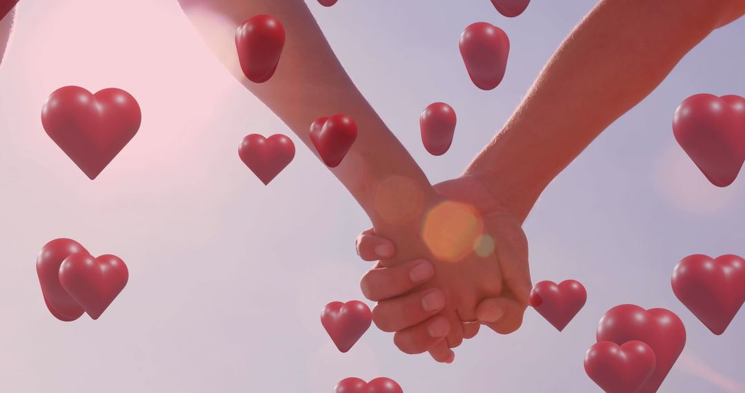 Couple Holding Hands with Floating Hearts Symbolizing Love