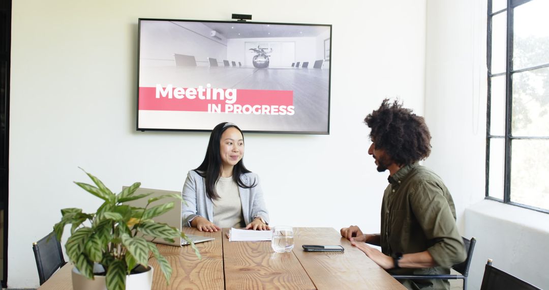 Diverse Professionals Discussing in Modern Office Meeting