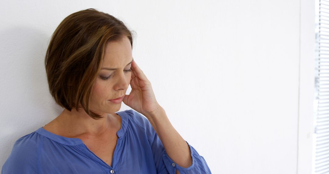 Woman with Short Brown Hair Feeling Stressed Against White Background - Free Images, Stock Photos and Pictures on Pikwizard.com