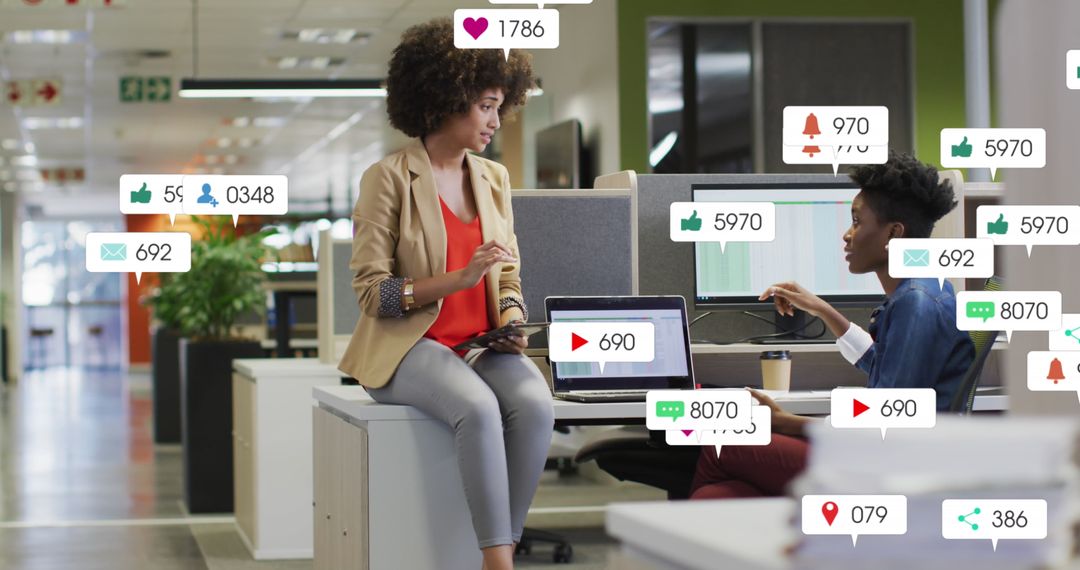 Diverse Coworkers Collaborating with Social Media Notifications in Office