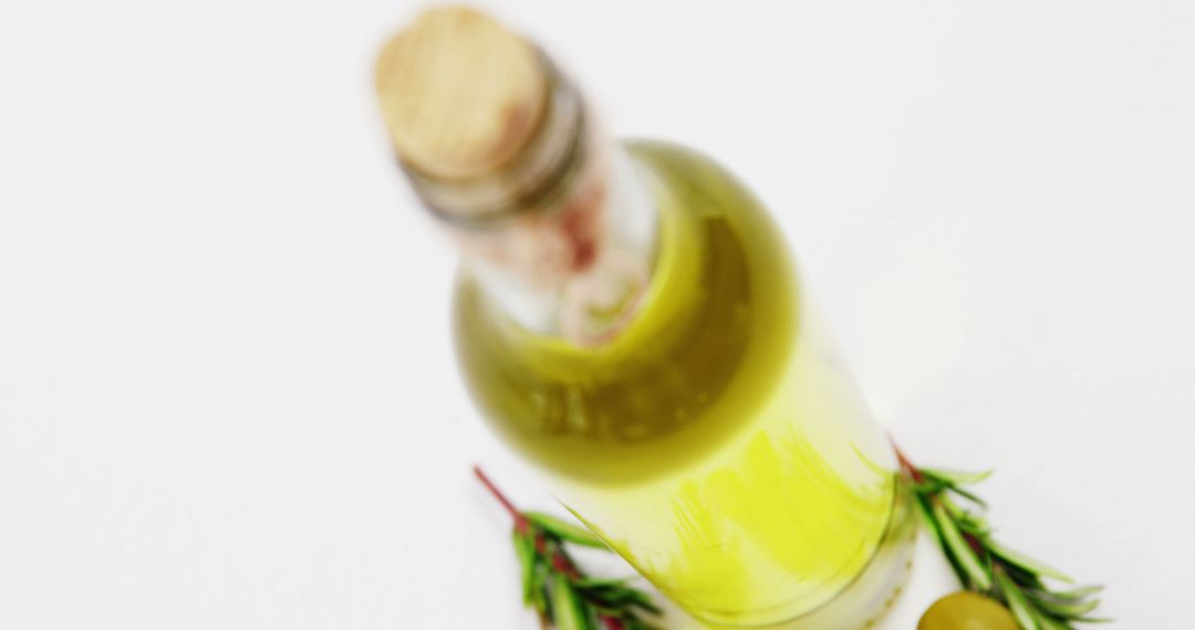 Bottle of Olive Oil with Fresh Rosemary on White Background - Free Images, Stock Photos and Pictures on Pikwizard.com