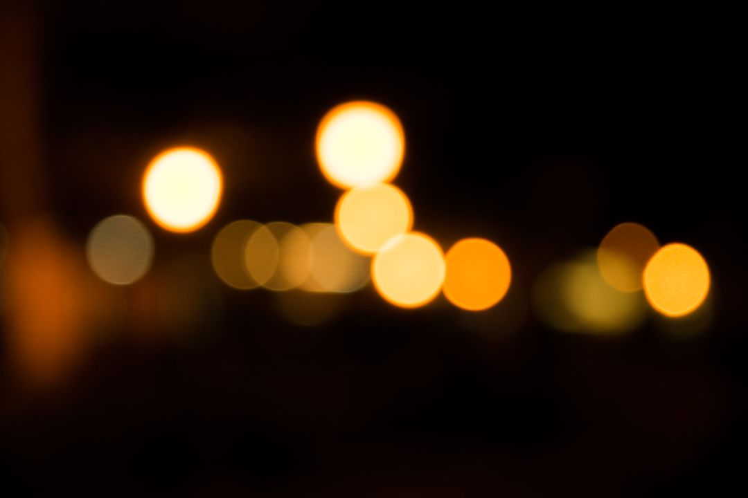 Warm Golden Bokeh Lights Blurring in Night - Free Images, Stock Photos and Pictures on Pikwizard.com