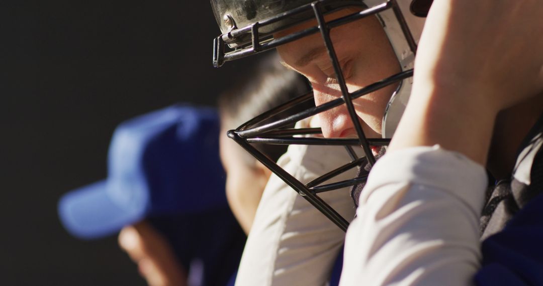 Focused Baseball Player Wearing Helmet During Game - Free Images, Stock Photos and Pictures on Pikwizard.com