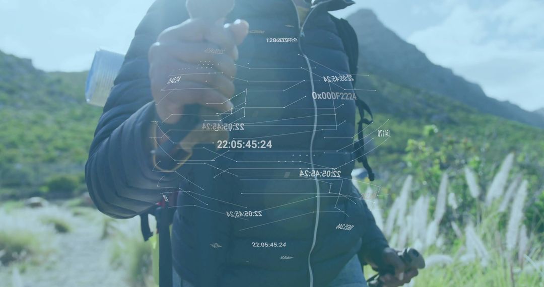 Hiker Using Futuristic Data Hologram on Mountain Trail