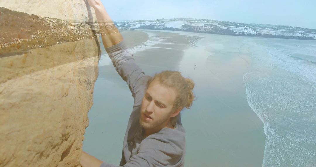 Man Climbing Coastal Cliff Embracing Nature Adventure