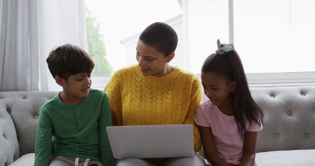 Mother Helping Children with Homework on Laptop - Free Images, Stock Photos and Pictures on Pikwizard.com