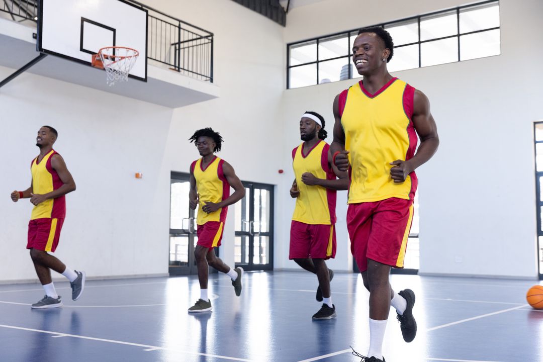 Joyful Basketball Team Energetically Practicing Indoor