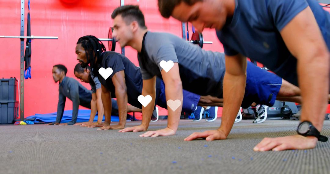 Group of Men Doing Push-Ups in Gym During High-Energy Team Fitness Training