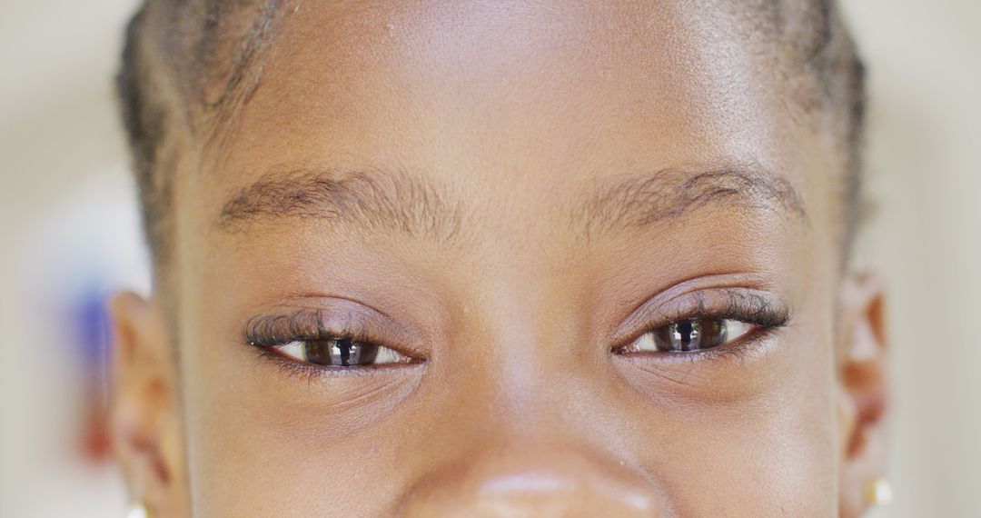 Close-Up Shot of Smiling Child's Eyes - Free Images, Stock Photos and Pictures on Pikwizard.com