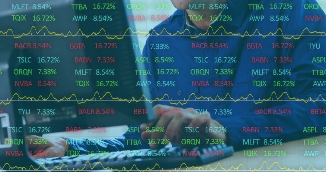 Financial Analyst Using Computer Overlaid with Stock Market Data