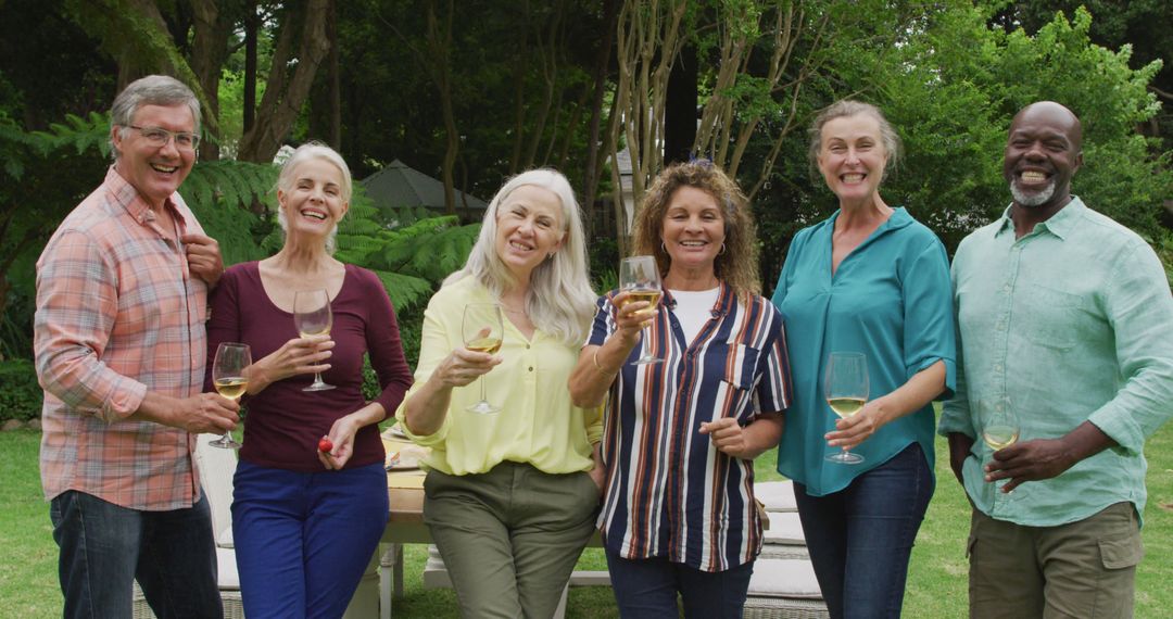 Smiling Group of Diverse Senior Friends Enjoying Wine Outdoors - Free Images, Stock Photos and Pictures on Pikwizard.com