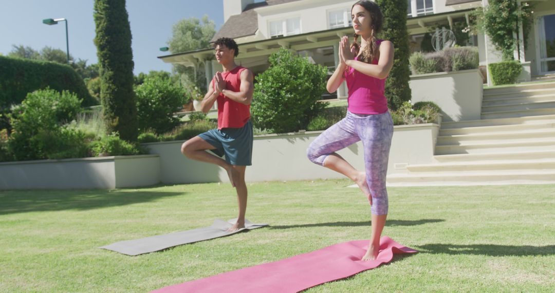 Young Couple Practicing Yoga on Mats in Backyard - Free Images, Stock Photos and Pictures on Pikwizard.com