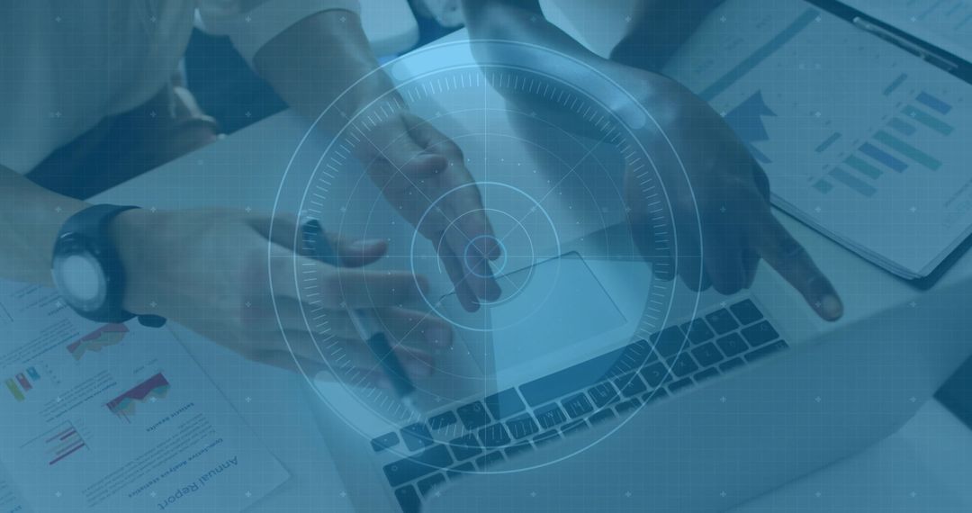 Colleagues Pointing and Gesturing Over Laptop With Analytics Charts and Digital Interface Overlay