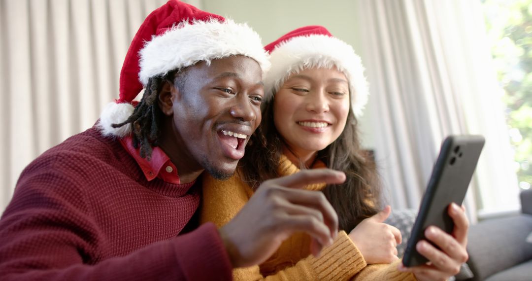 Happy Couple Video Calling During Christmas Holiday Celebration - Free Images, Stock Photos and Pictures on Pikwizard.com