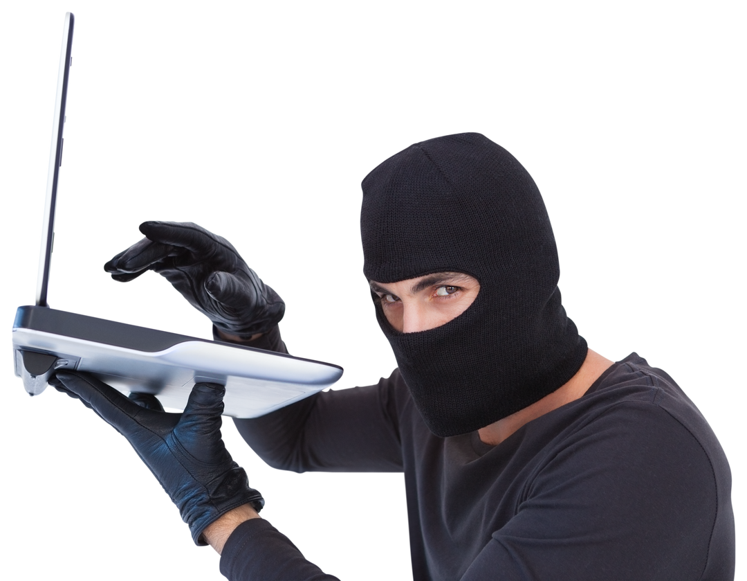 Focused Burglar Hacking Into Laptop Wearing Black Gloves And Mask - Download Free Stock Images Pikwizard.com