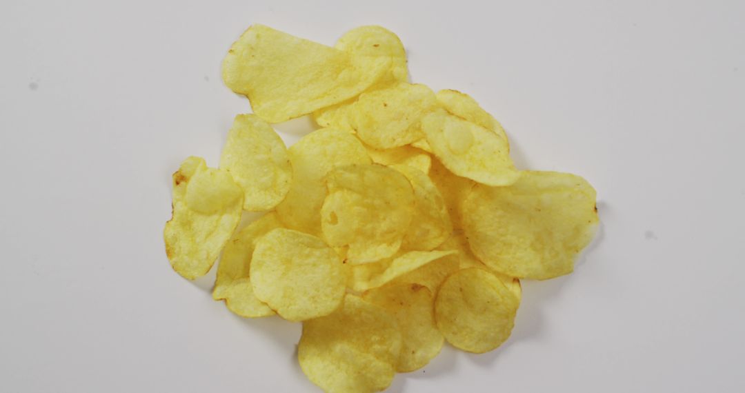 Crispy Layered Potato Chips on White Background - Free Images, Stock Photos and Pictures on Pikwizard.com