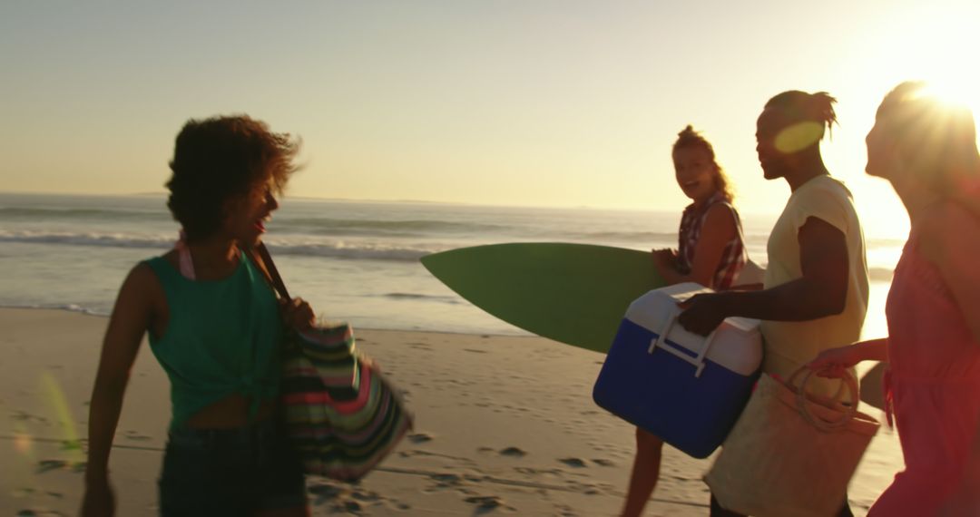 Friends Enjoying Beach Sunset with Surfboard and Cooler - Free Images, Stock Photos and Pictures on Pikwizard.com