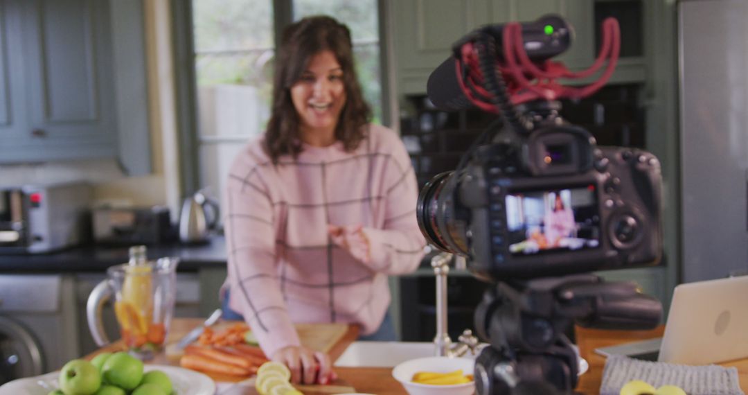 Woman Creating Cooking Video in Kitchen Using DSLR Camera for Vlog - Free Images, Stock Photos and Pictures on Pikwizard.com