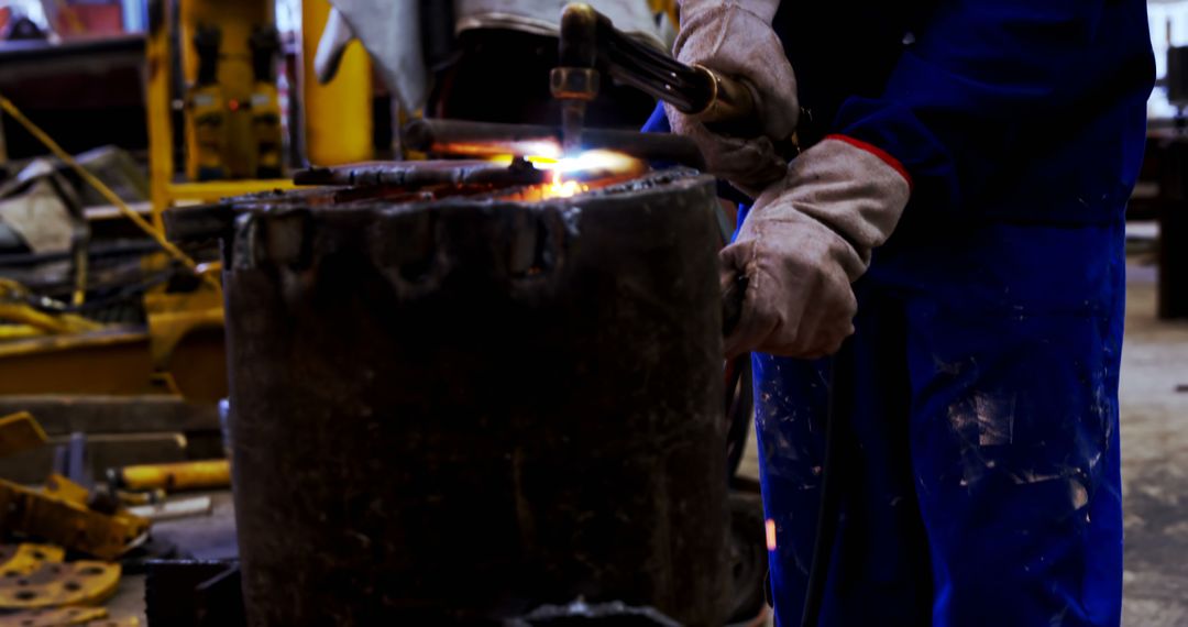 Industrial Worker Welding Metal Wears Safety Gloves and Protective Gear - Free Images, Stock Photos and Pictures on Pikwizard.com