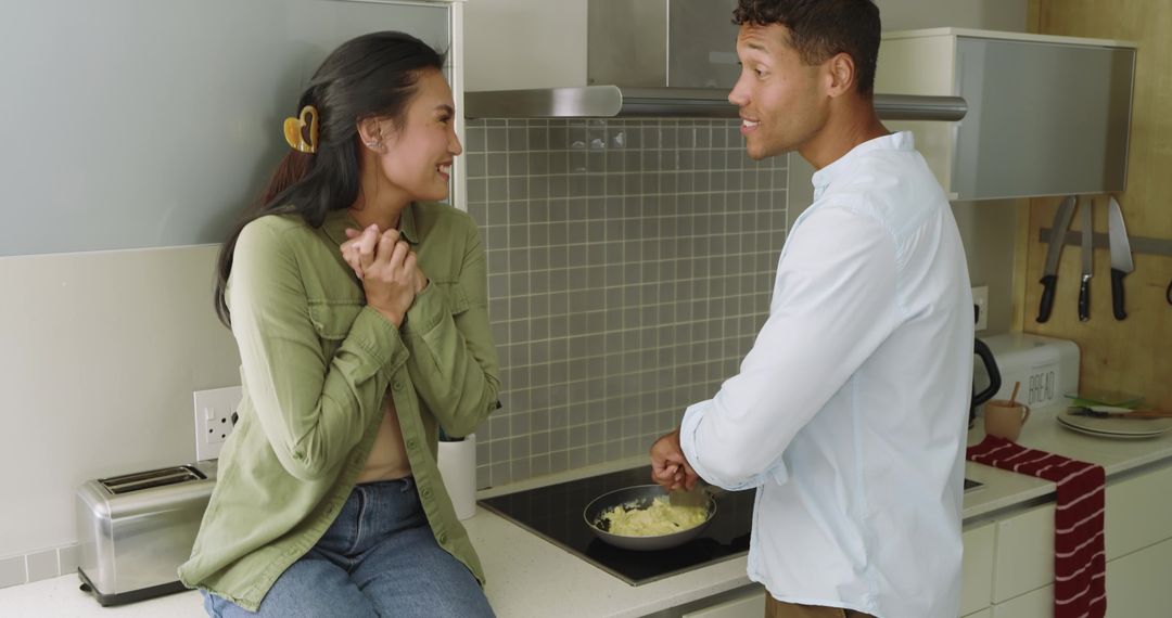 Diverse Couple Cooking Breakfast Together in Modern Kitchen, Smiling and Chatting
