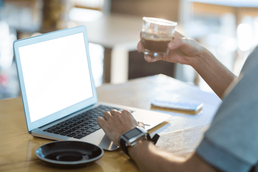 Transparent Laptop Screen with Coffee in Daylight Setting