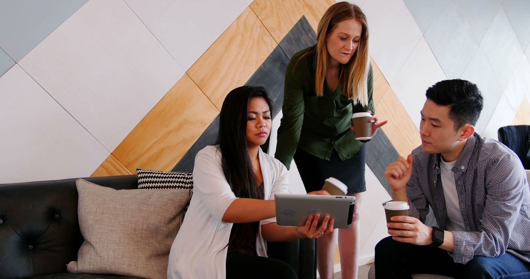 Business Team Discussing Work Using Tablet