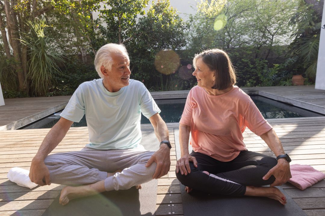 Senior Couple Practicing Relaxation by Plunge Pool