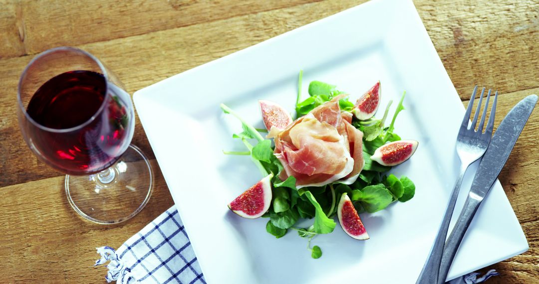 Gourmet Salad with Figs and Prosciutto on Wooden Table - Free Images, Stock Photos and Pictures on Pikwizard.com