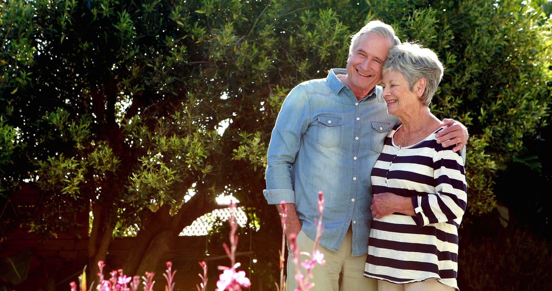 Senior Couple Embracing in Garden - Free Images, Stock Photos and Pictures on Pikwizard.com