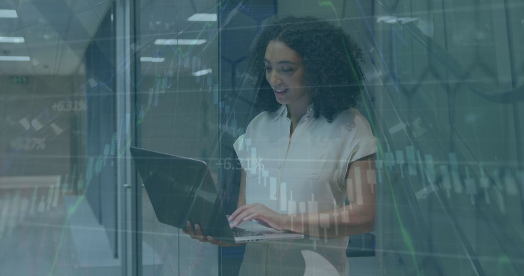 Businesswoman Using Laptop with Digital Financial Graph Overlay