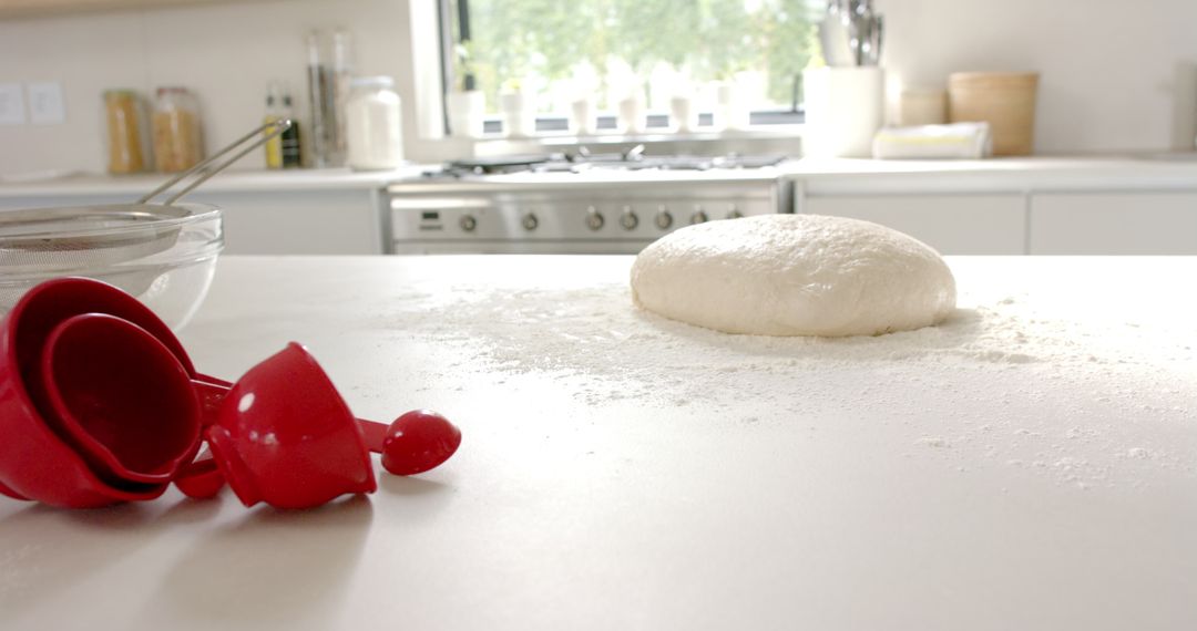 Fresh Dough on Floured Counter in Bright Modern Kitchen