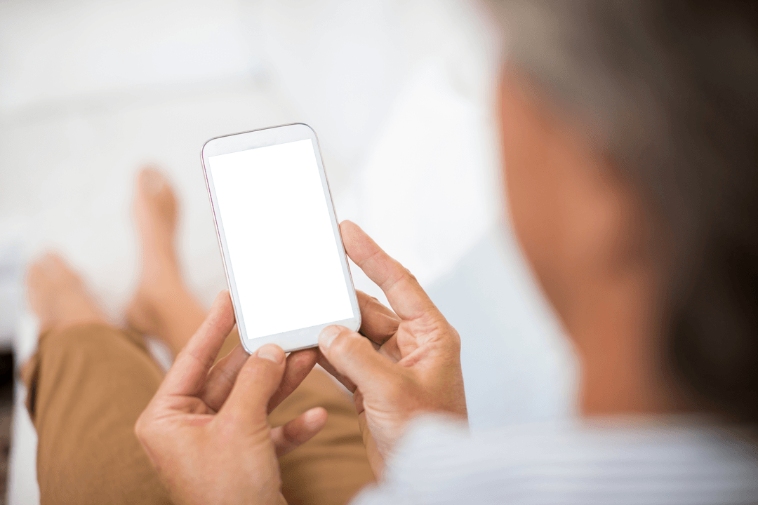 Transparent Smartphone Use by Mature Man in Relaxed Home Setting