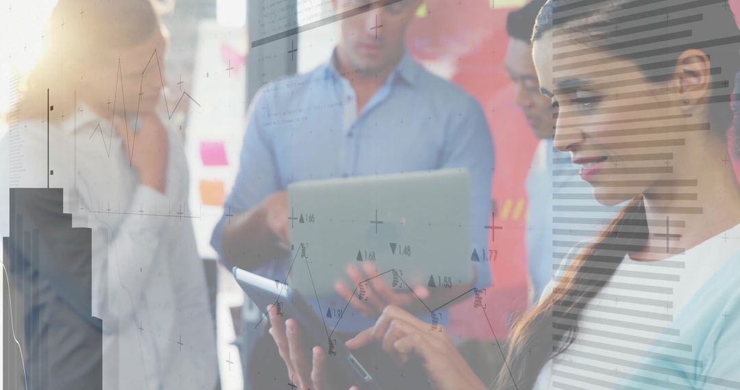 Business Team Analyzing Data with Digital Devices in Modern Office