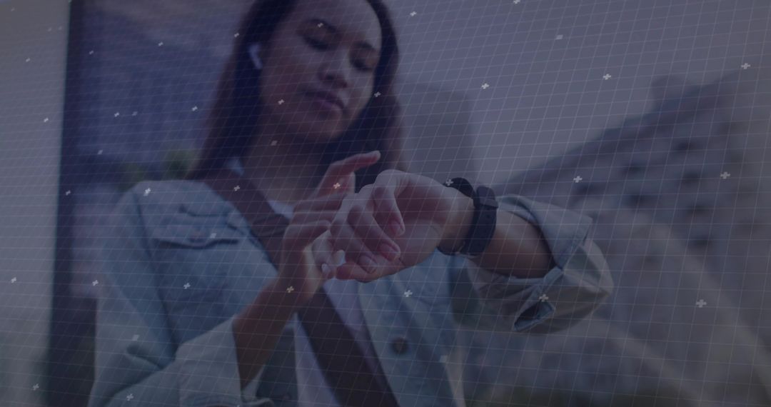 Woman Interacting with Smartwatch in Urban Environment