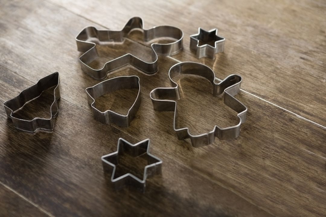 Various cookie cutters on wooden table - Free Images, Stock Photos and Pictures on Pikwizard.com